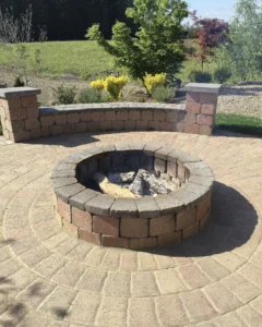 Circular Paver Patio With Wood Fire Pit and Custom Curved Accent Wall-Bench